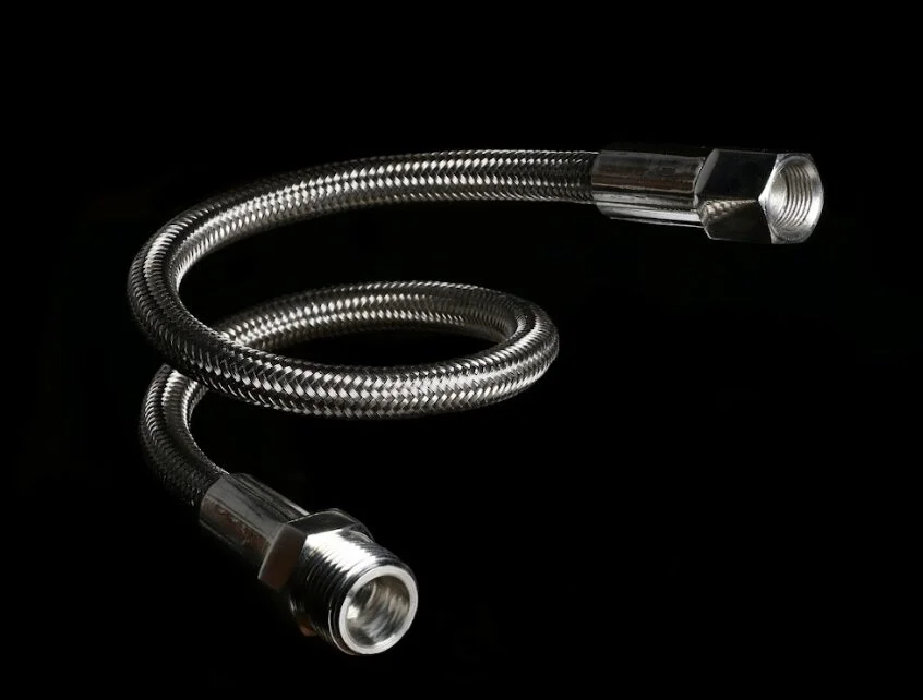Stainless steel braided PTFE hose assembly with crimped end fittings